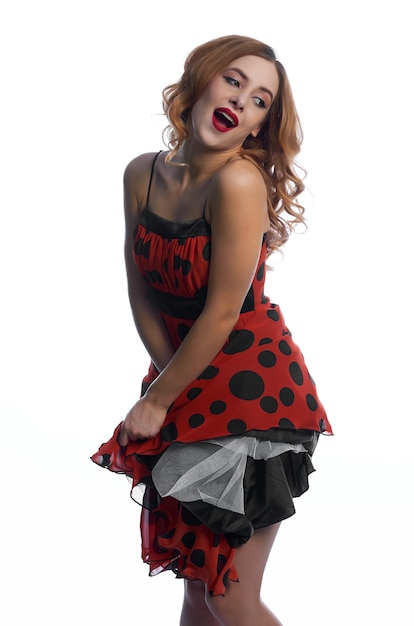 A girl in a red dress on a white background.fun and emotions.