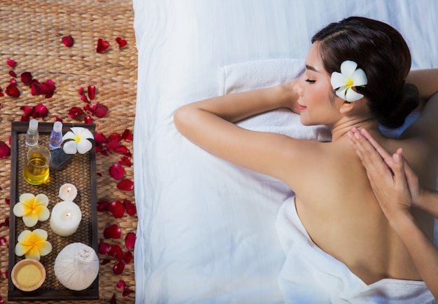 Girl relaxes in spa salon with hand massage