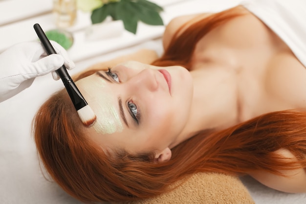 Girl relaxing in a bed into the spa