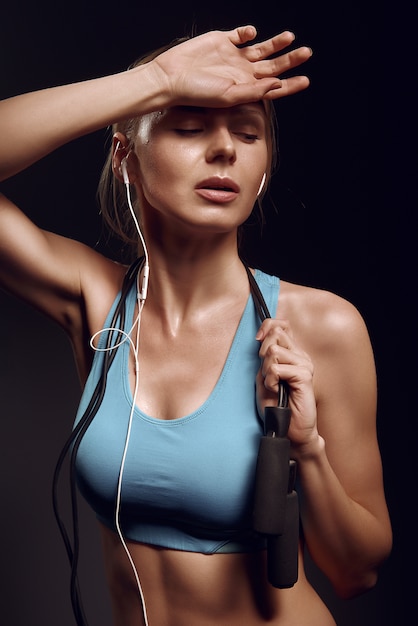 Girl resting after exercises in the gym