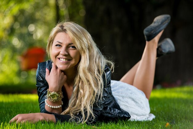 Girl Resting On Grass On A Sunny Day