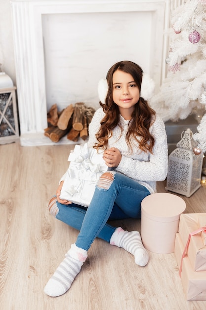 Girl in a room with Christmas decorations