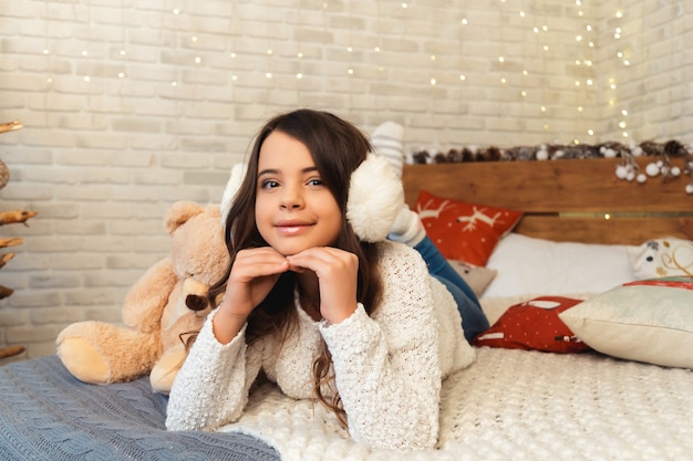 Girl in a room with Christmas decorations