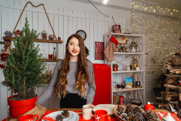 Girl in a room with Christmas decorations