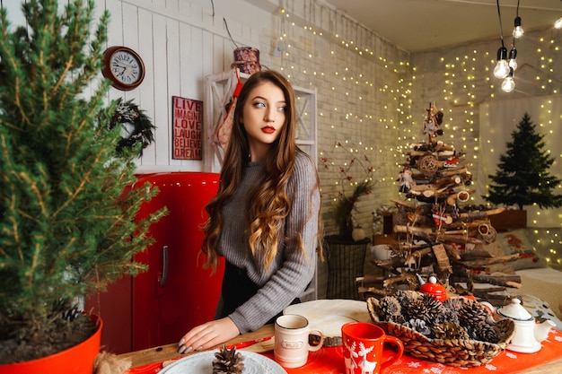 Girl in a room with Christmas decorations