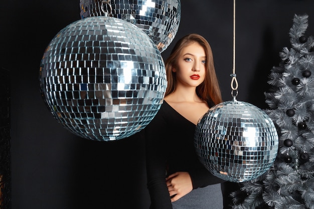 Girl in a room with Christmas decorations