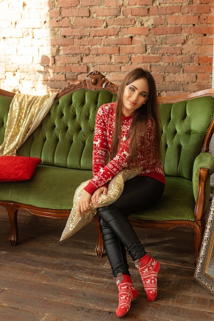 Girl in a room with Christmas decorations