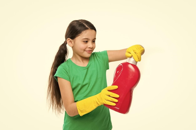 Girl in rubber gloves for cleaning hold big plastic bottle chemical soap liquid white background Use professional product for cleaning Useful product housekeeping Cleaning supplies Check smell