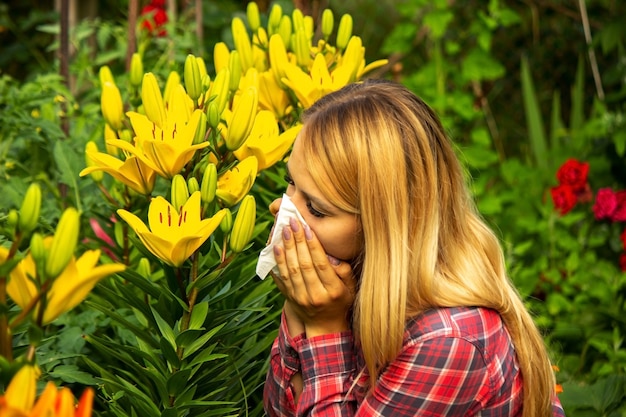 Photo girl's allergy to flowers. selective focus