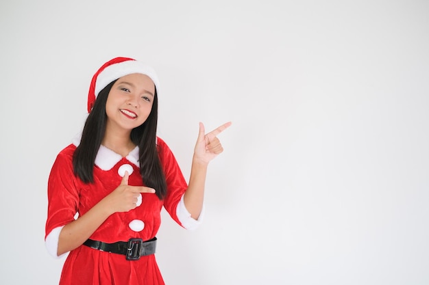 The girl in santa claus dress on christmas party