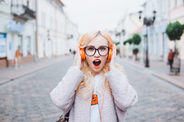 Girl screaming while listening to music