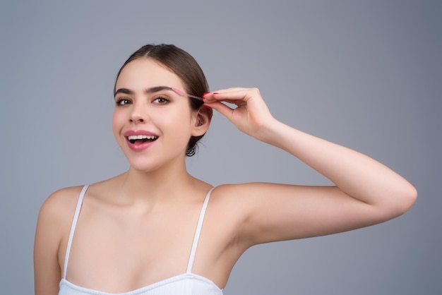 girl shaping brown eyebrows woman eye with beautiful eyebrows perfect shaped brow eyelashes with brow gel brush paint eyebrows