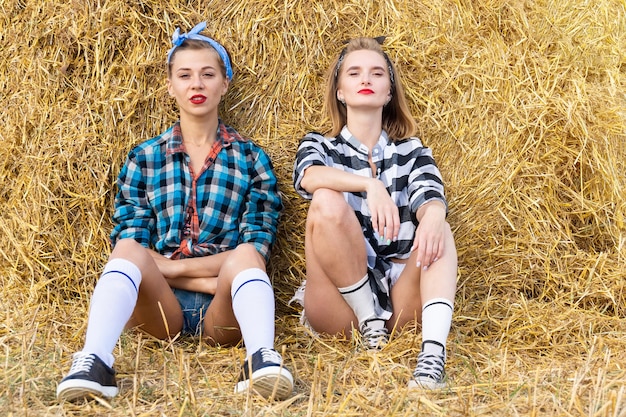 Girl on a sheaf of hay