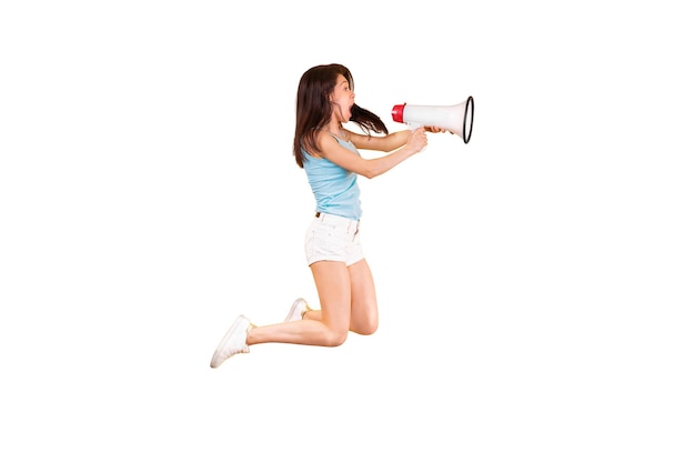 Photo girl shouting through a megaphone isolated on white background