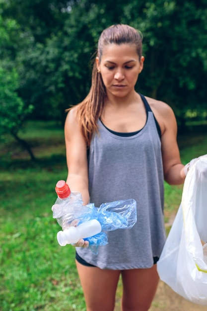 Girl showing garbage she has collected