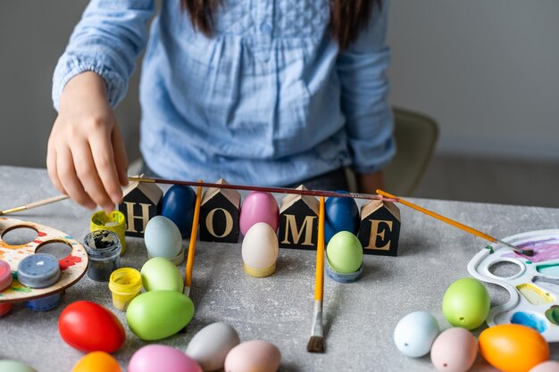 A girl showing her painted Easter Egg.