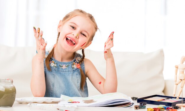 Girl showing her painted palms