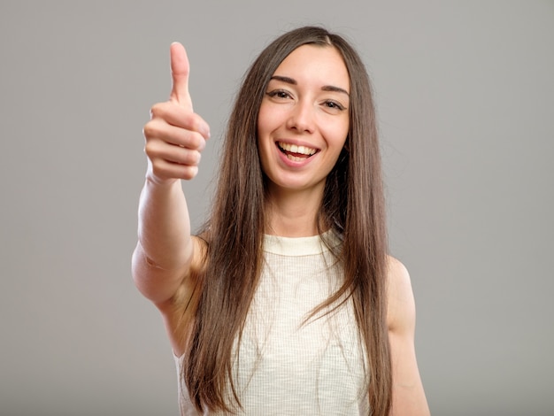 Girl showing thumb up