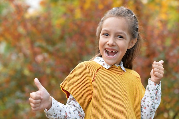 Girl showing thumbs up