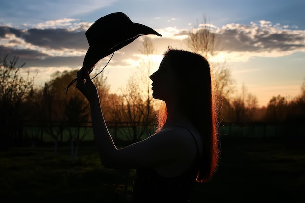 Girl silhouette cowboy