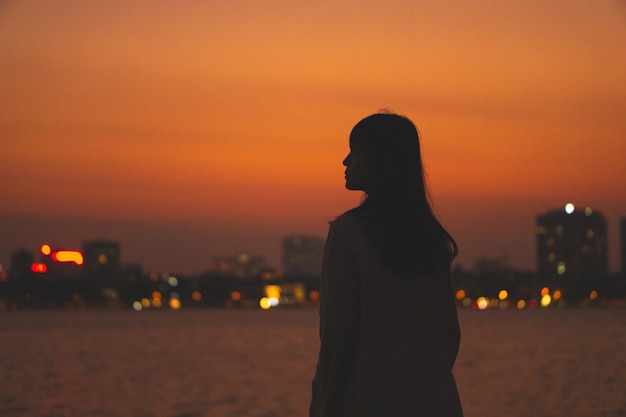 Girl silhouette portrait and beautiful sunset