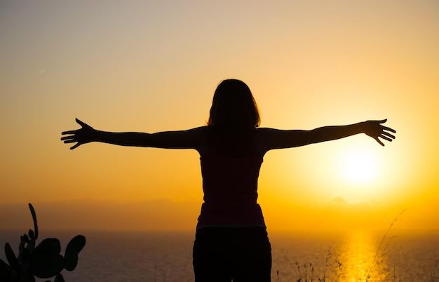 Girl silhouette at sunset