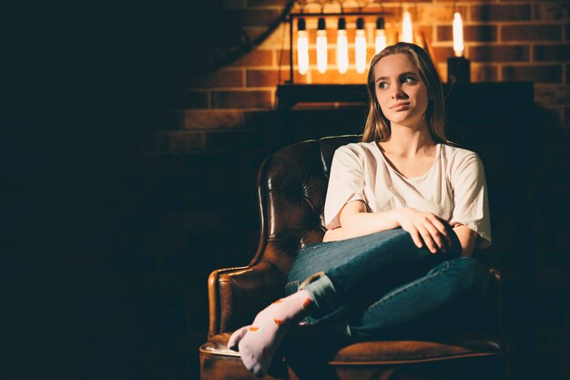 Girl sitting on a chair