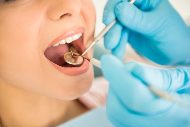 Girl sitting at the dentist's appointment.