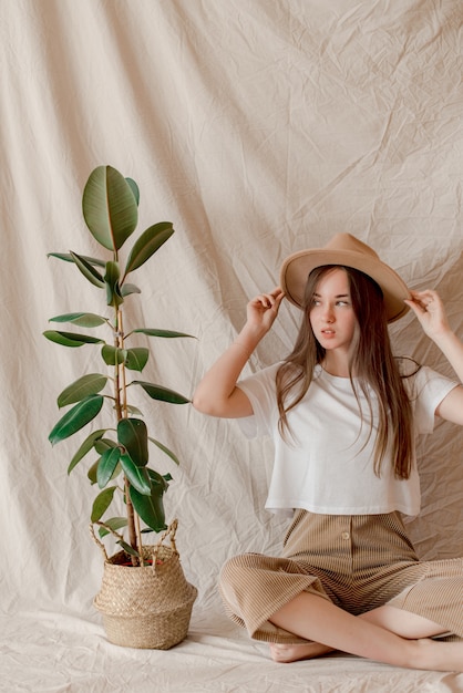 Girl sitting on fabric background