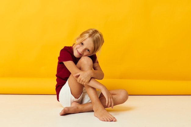 Girl sitting on the floor childhood emotions fun