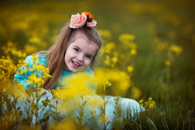 Girl sitting in flowers