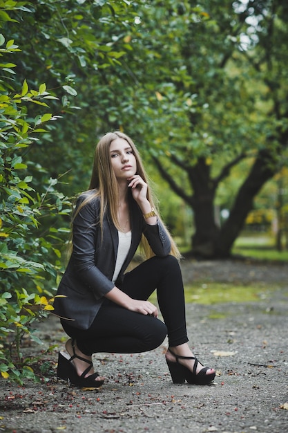 Girl sitting near the bush 3689