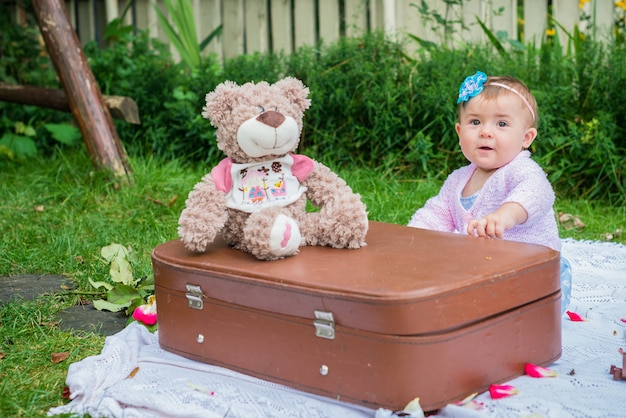 Girl sitting near suitcase