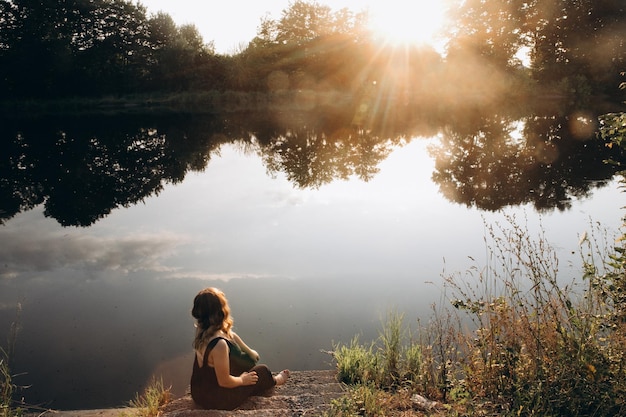 girl sitting on the shore