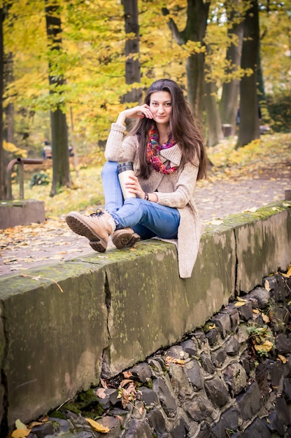 Girl sitting on the stone