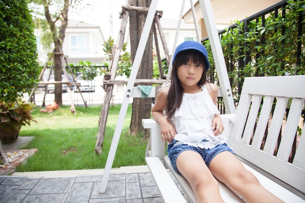 girl sitting on a swing