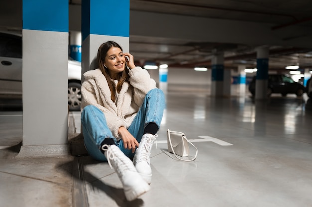 Girl sitting in the underground parking