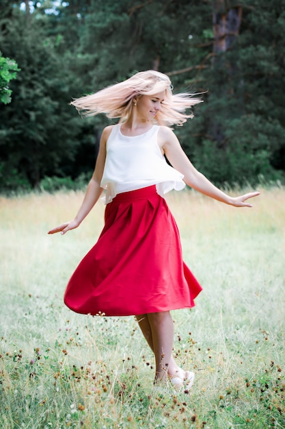 girl in the skirt is dancing