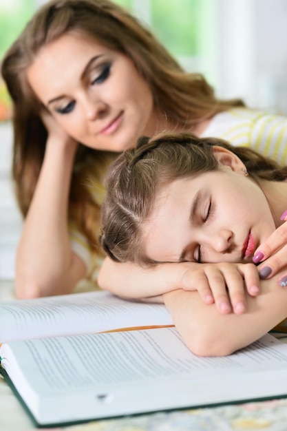 Girl sleeping on book