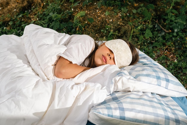 Girl sleeping outdoors in the garden