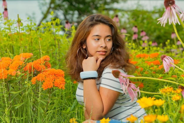 Girl smelling very beautiful flowers