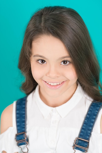 Girl smile with young face skin on blue background