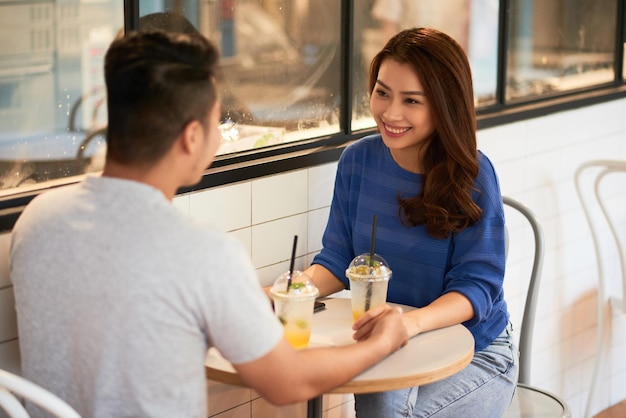 Girl Smiling At Asian Boyfriend