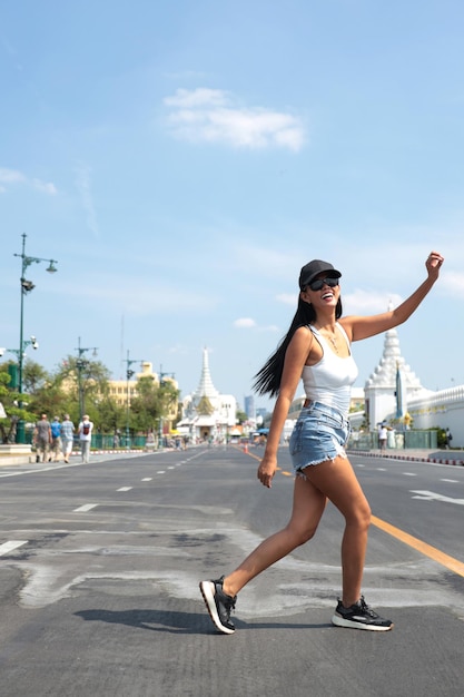 Girl smiling crossing the street