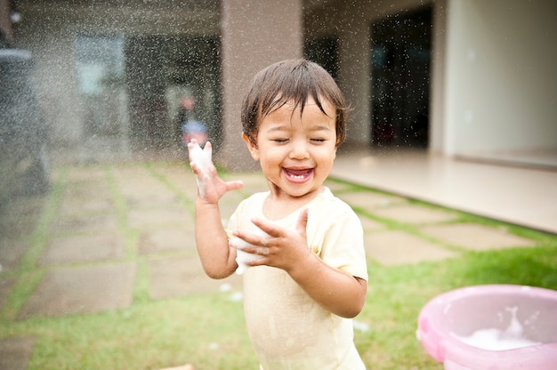 Girl smiling and having fun with water