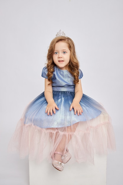 Girl smiling and posing with princess dress