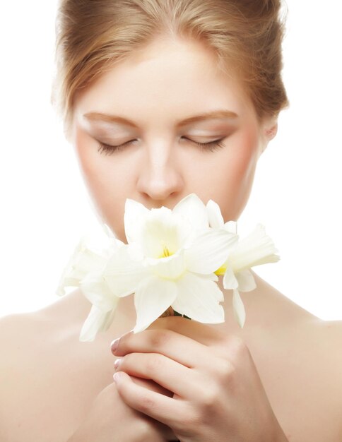 Girl smiling and with flower narcissus