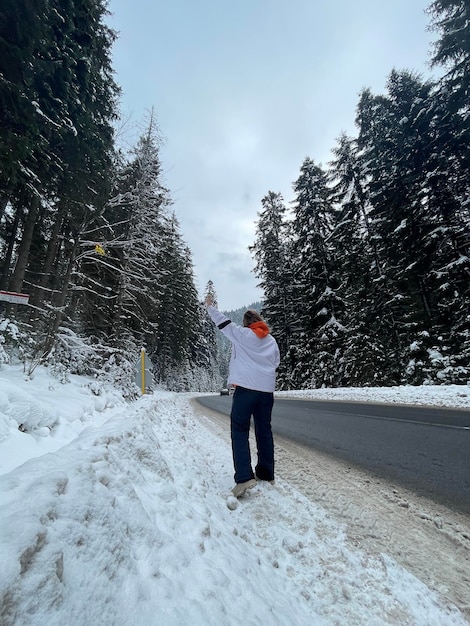 Girl on a snowy forest road