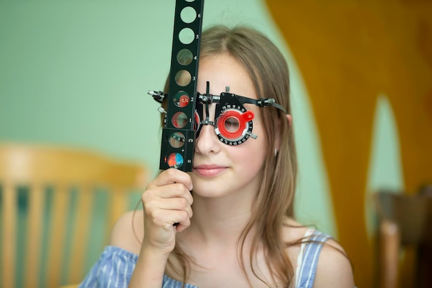 A girl in special glasses for the treatment of vision problems