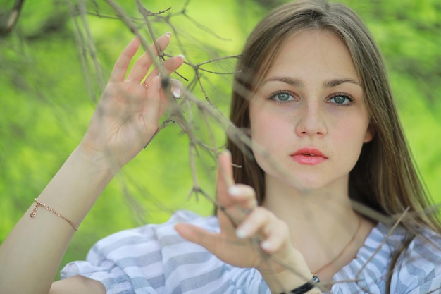 A girl in a spring green park on a walk